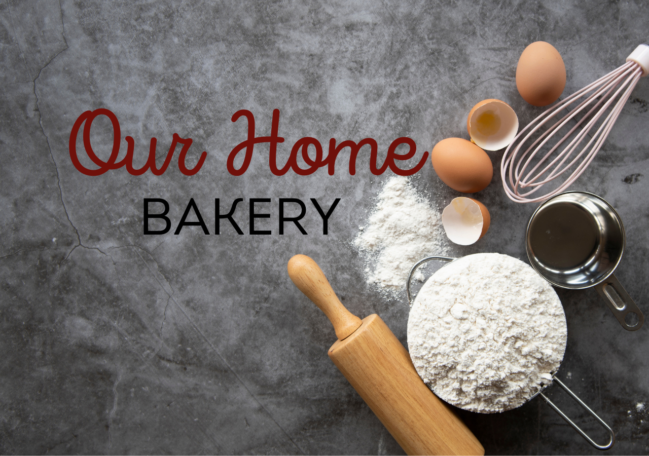 Text words of Our Home Bakery on a grey background with a rolling pin, eggs, bowl of flour, and a whisk